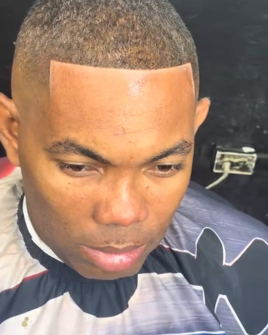 Skin fade with a sharp lineup by Military Cutz