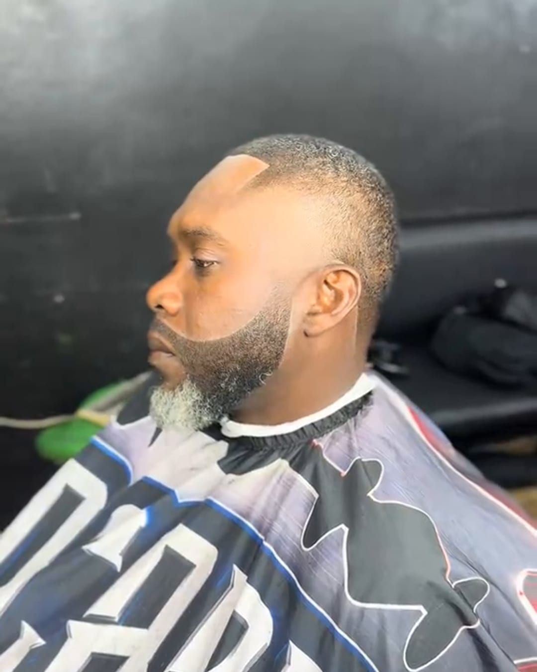 Beard trim and lineup with a low fade by Military Cutz