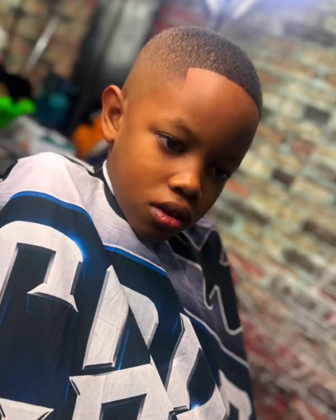 Kids cut with a clean fade by Military Cutz